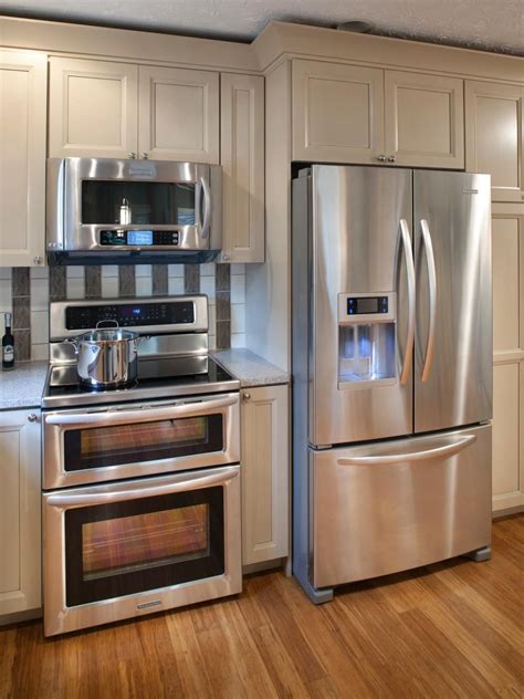 cinnamon cabinet stainless steel stove refrigerator|appliances with white cabinets.